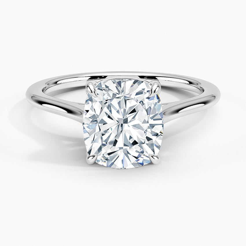 Petite Four Prong Solitaire Cushion Moissanite Ring