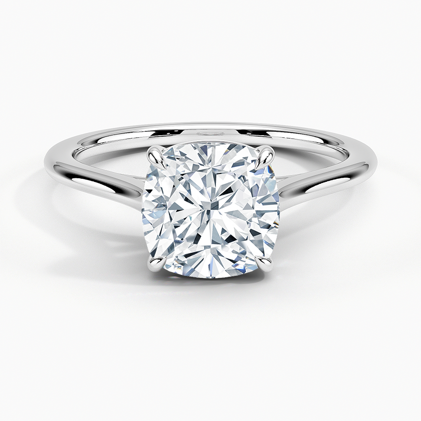 Petite Four Prong Solitaire Cushion Moissanite Ring