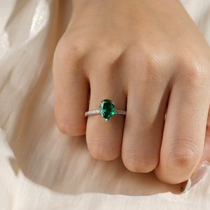 Pear-Shaped Emerald Engagement Ring With Hidden Halo