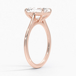 Petite Four Prong Solitaire Emerald Moissanite Ring