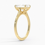 Petite Four Prong Solitaire Emerald Moissanite Ring