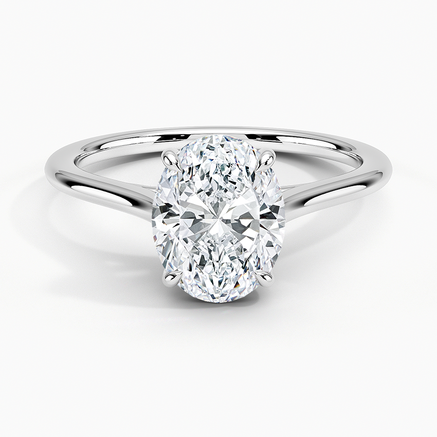 Petite Four Prong Solitaire Oval Moissanite Ring