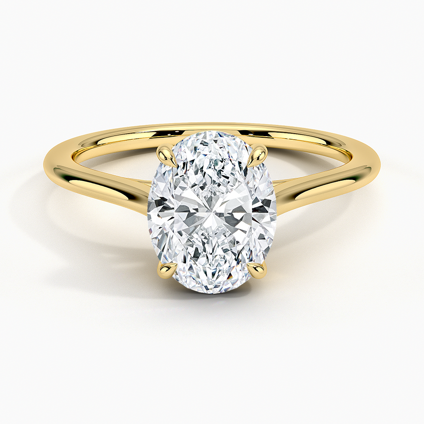 Petite Four Prong Solitaire Oval Moissanite Ring