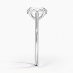 Petite Four Prong Solitaire Oval Moissanite Ring