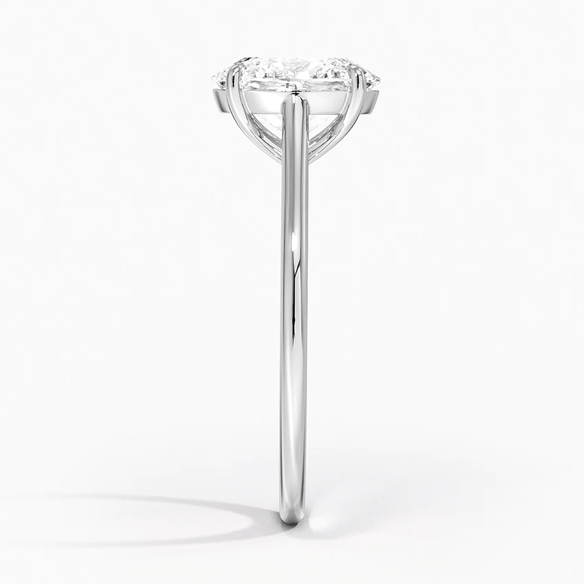 Petite Four Prong Solitaire Oval Moissanite Ring