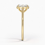 Petite Four Prong Solitaire Oval Moissanite Ring