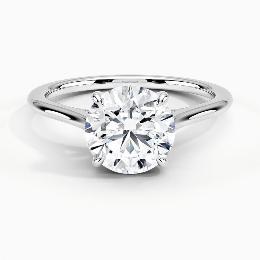 Petite Four Prong Solitaire Round Moissanite Ring