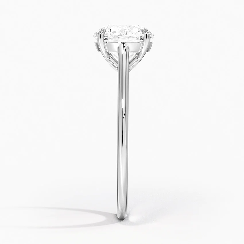 Petite Four Prong Solitaire Round Moissanite Ring