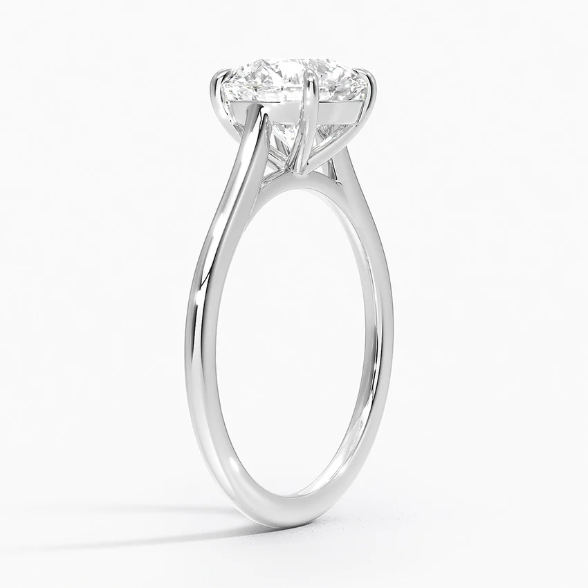 Petite Four Prong Solitaire Round Moissanite Ring