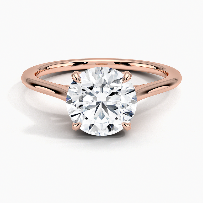 Petite Four Prong Solitaire Round Moissanite Ring