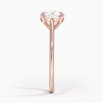 Petite Four Prong Solitaire Round Moissanite Ring