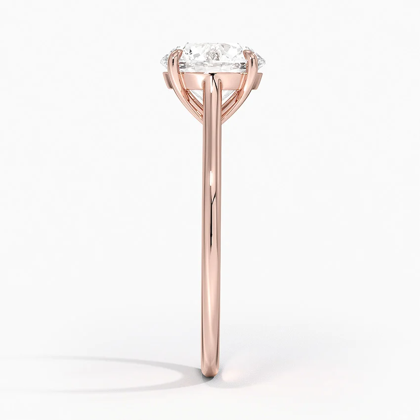 Petite Four Prong Solitaire Round Moissanite Ring