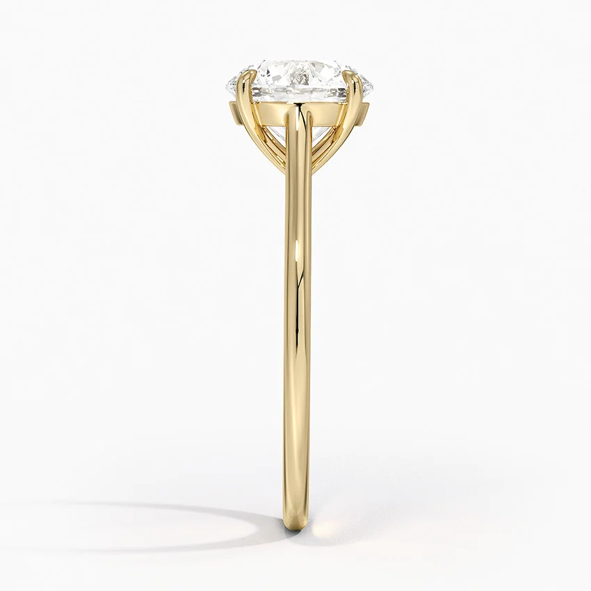 Petite Four Prong Solitaire Round Moissanite Ring